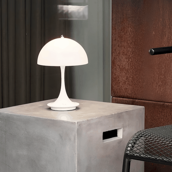 White mushroom small table lamp with LED light on modern concrete side table in contemporary room