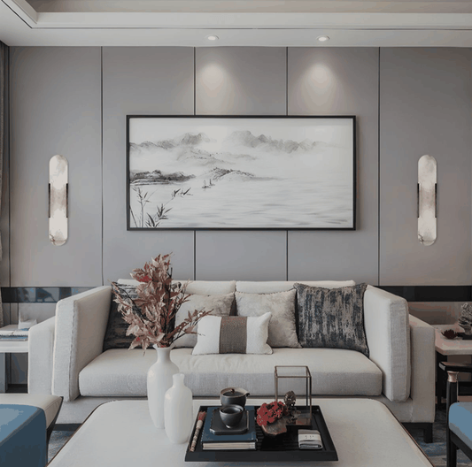 Modern marble wall light with gold and black finishes mounted on living room walls