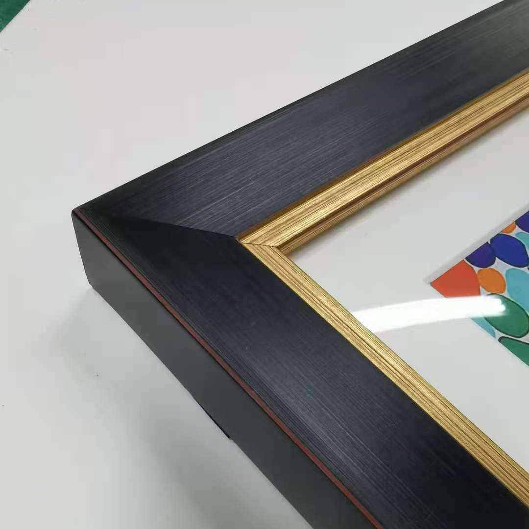 Large abstract wall art with black and gold frame and colorful design under plexiglass for living room decor