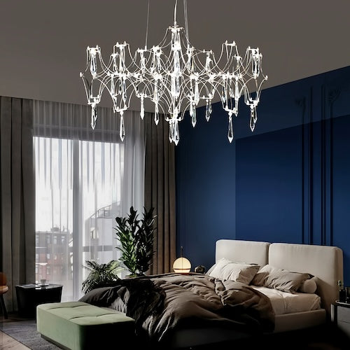 Stylish LED crystal chandelier illuminating a dining area with modern elegance - sparkledecor.com