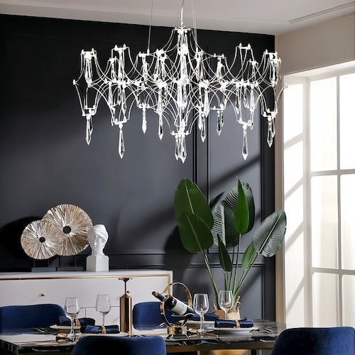 Stylish LED crystal chandelier illuminating a dining area with modern elegance - sparkledecor.com
