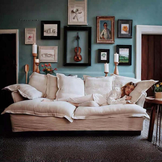 Beige Nordic style 2-seater cloud sofa with washable fabric cover and down filling for small living spaces