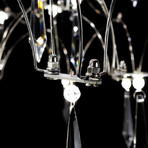 Stylish LED crystal chandelier illuminating a dining area with modern elegance - sparkledecor.com