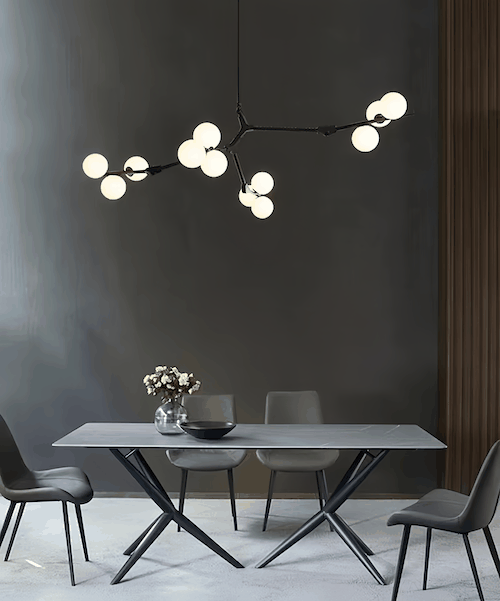 Nordic Chandelier Light with black finish and adjustable hang rods over modern dining table