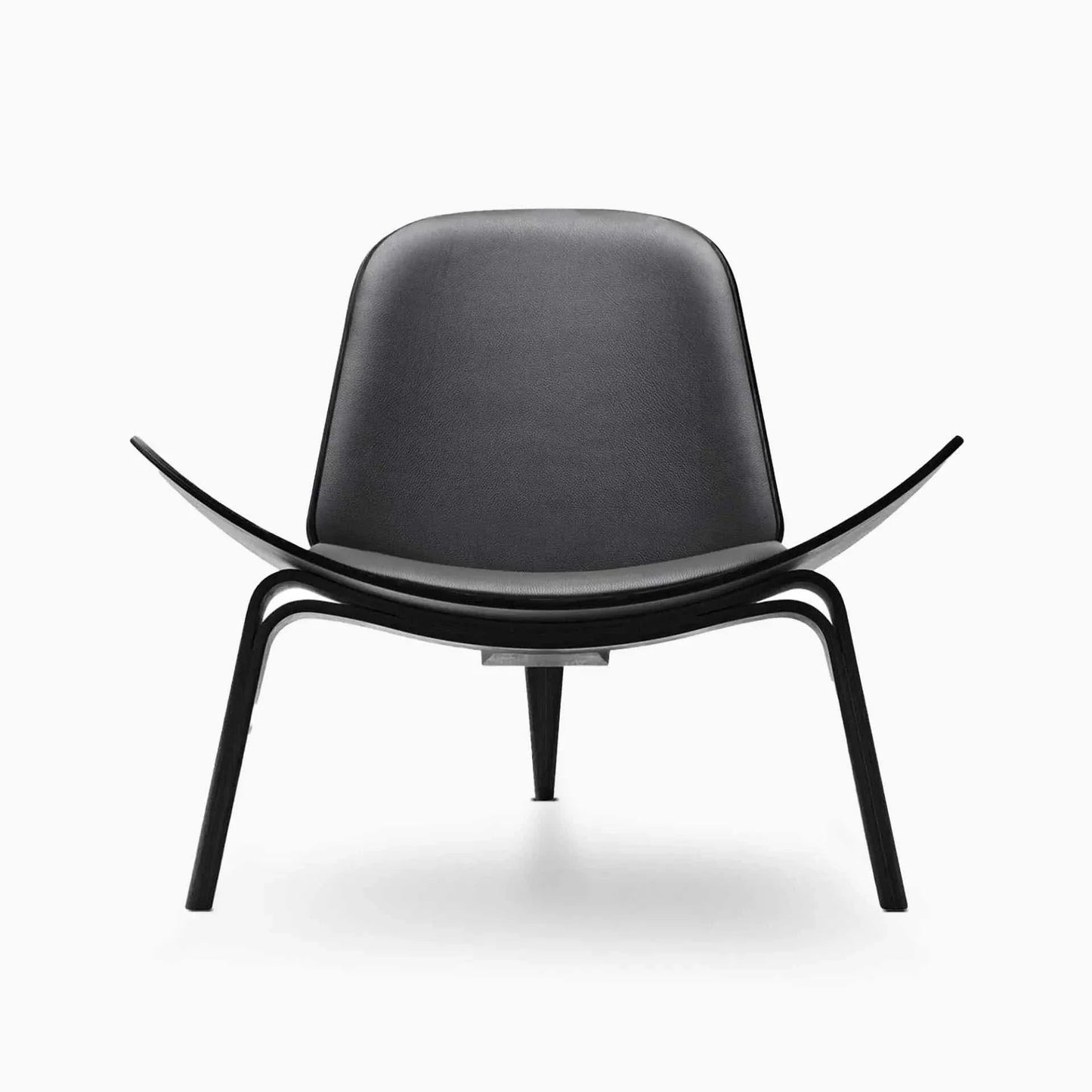 Shell Chair in black leather and walnut finish, featuring sleek Danish mid-century design with ergonomic curved seat and three-legged frame.
