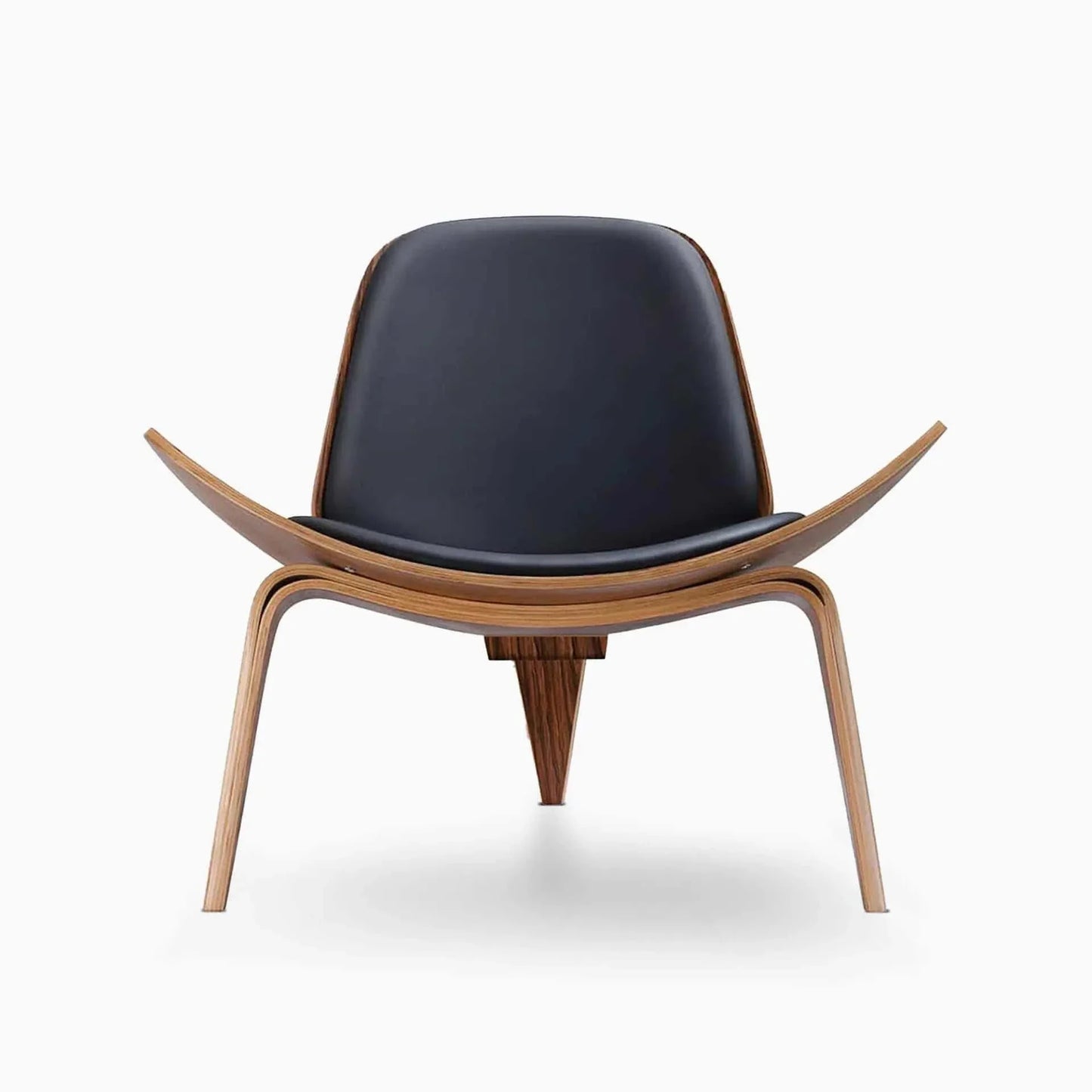 Shell Chair in black leather with walnut finish, mid-century design with curved backrest and three-legged frame.