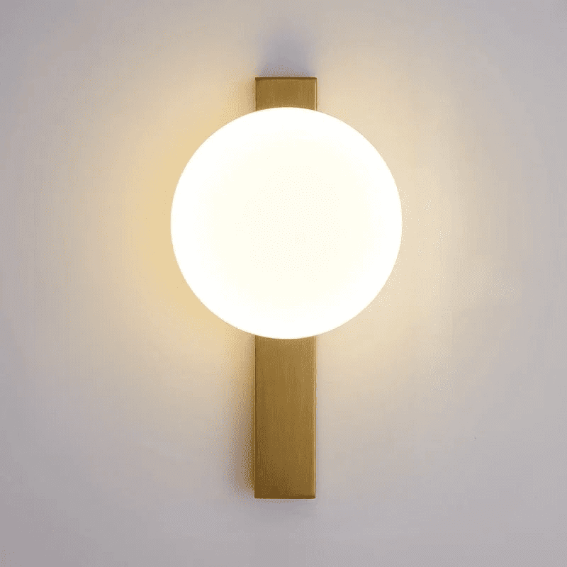 Minimalist LED wall lamp with warm circular light and gold vertical mount, perfect for home or office lighting.