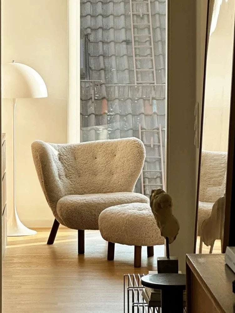 Little Petra Lounge Chair and Ottoman in soft faux sheepskin with cherry wood legs in modern Danish design replica