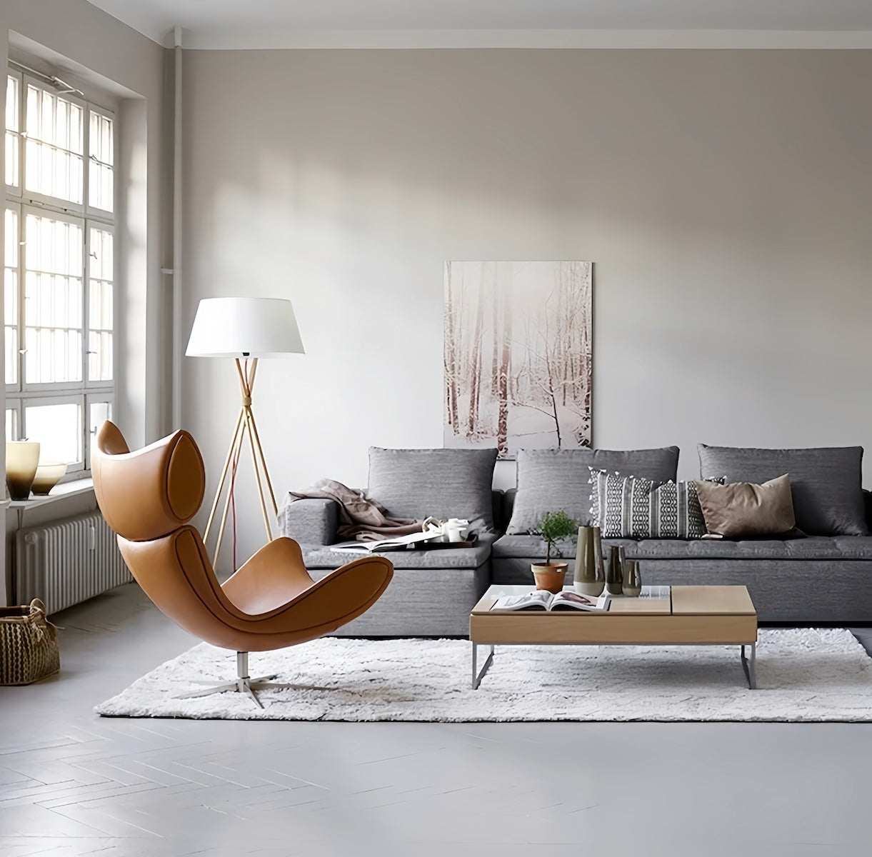 Imola Lounge Chair with footstool in modern living room, leather upholstery, ergonomic Danish design