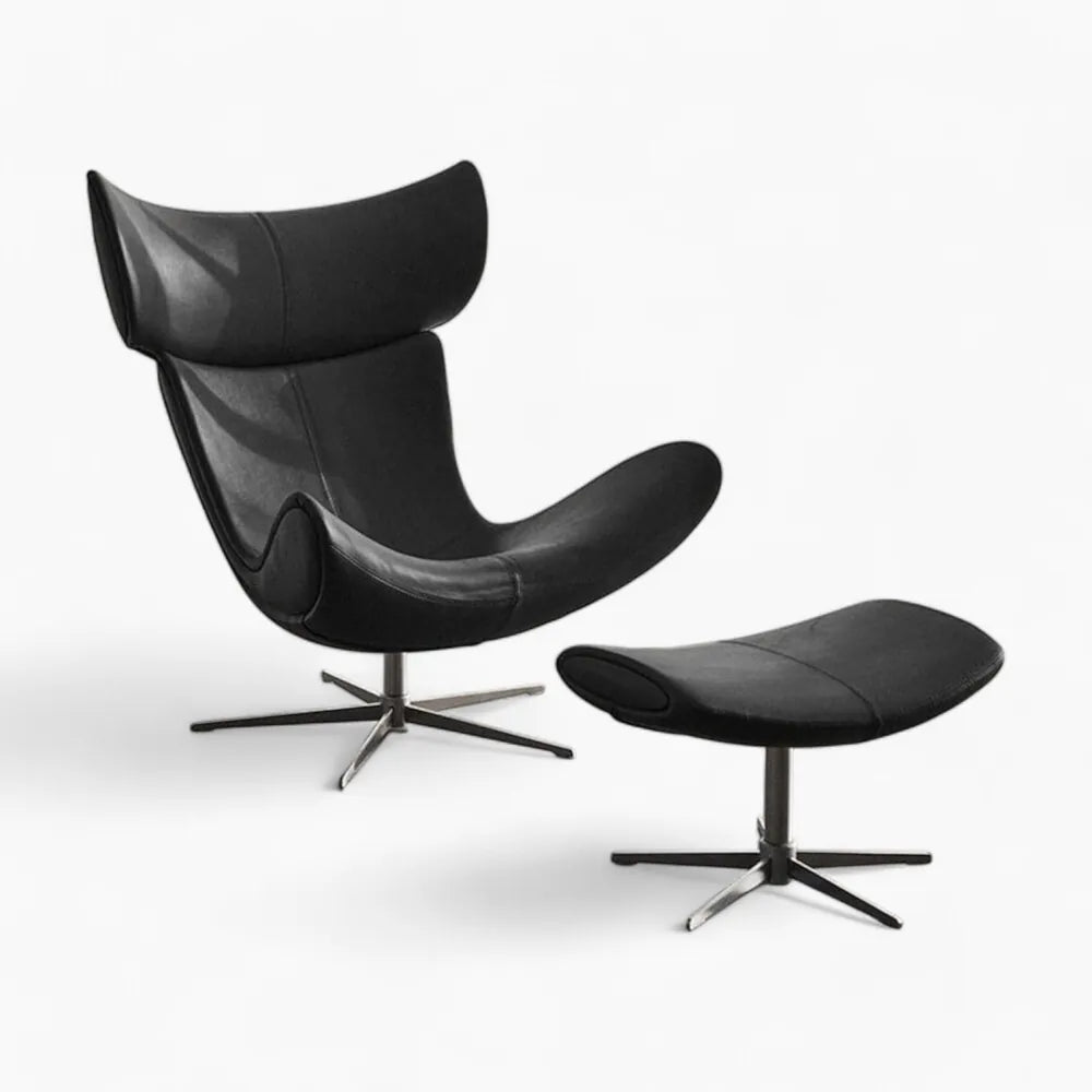 Imola Lounge Chair with Footstool Replica in black Italian leather upholstery, featuring ergonomic curves and chrome-finished legs.