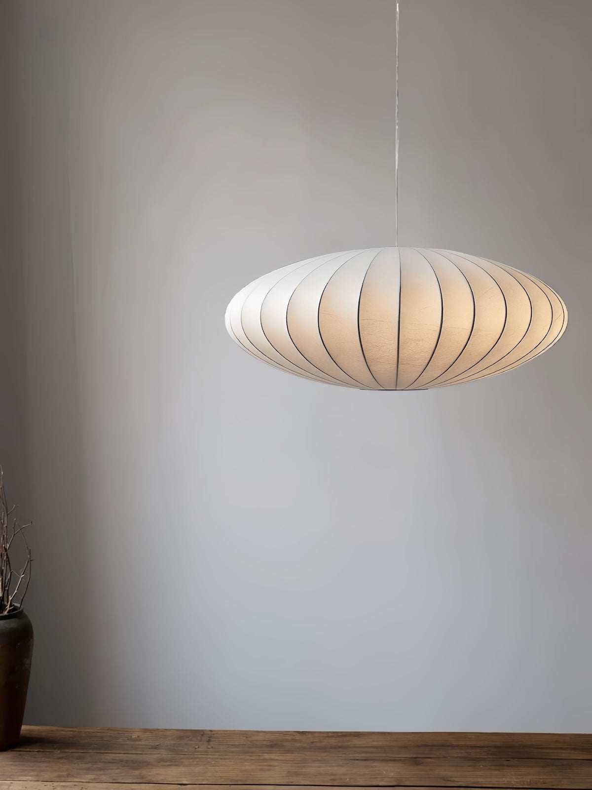 Minimalist indoor disk-shaped silk pendant light with warm white LED and sleek modern design