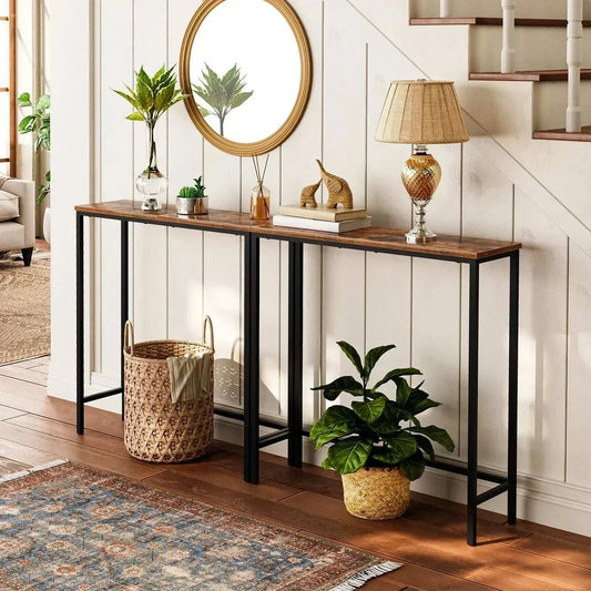 Retro nostalgia slim narrow console table with rustic brown chipboard top and black metal legs in entryway.