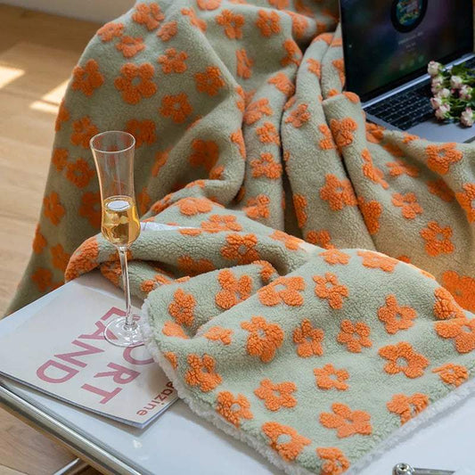 full fleece blanket with orange floral pattern, cozy knit coral fleece fabric, soft and portable for travel and home use