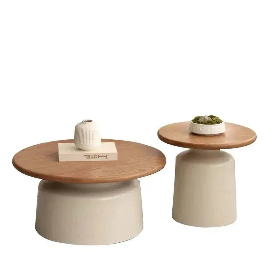 Minimalist round coffee tables with oak wood tops and off-white bases for modern living rooms