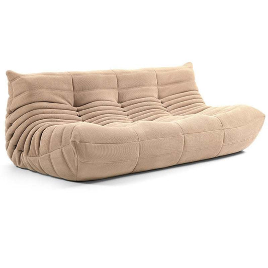 Beige corduroy Togo couch with ergonomic design and plush cushioning