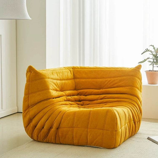 Luxurious suede Togo corner sofa in mustard yellow with plush upholstery and modern design