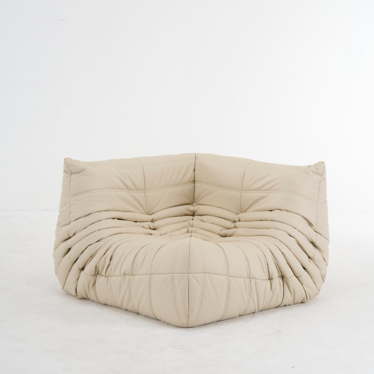 Customizable leather Togo corner sofa in beige, featuring premium quality, ergonomic design, and versatile color options for stylish comfort.