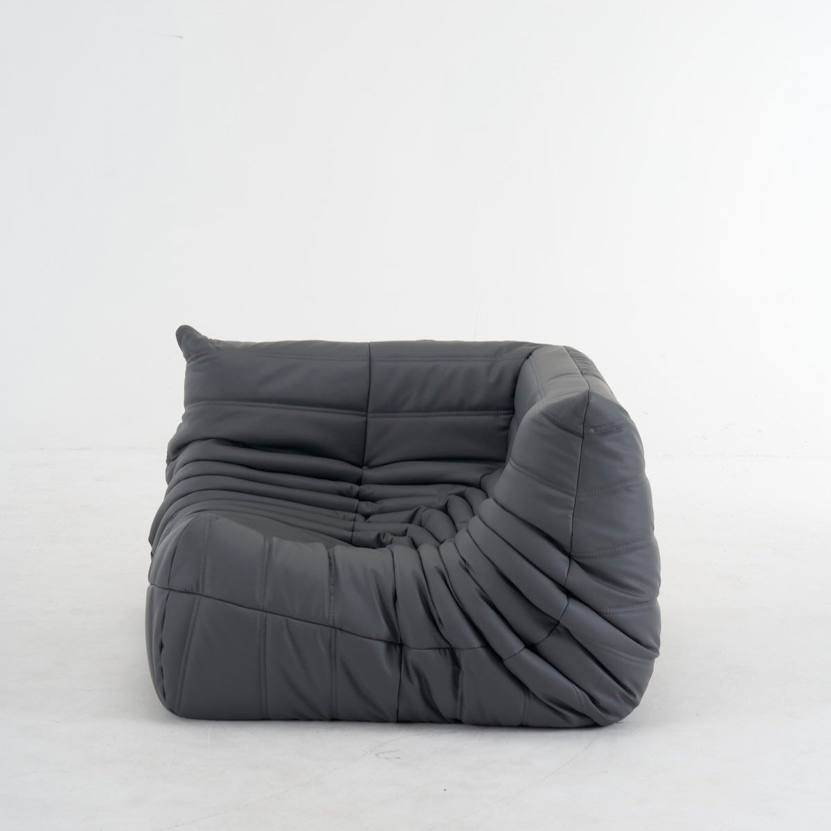 Customizable leather Togo corner sofa with premium upholstery in gray, featuring ergonomic design and versatile color options.