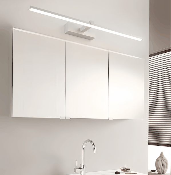 Modern LED bathroom wall light mounted above mirror with sleek acrylic shade in a minimalist bathroom setting