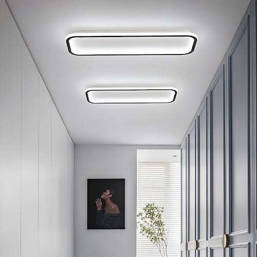 Modern rectangular LED ceiling lights with black trim in minimalist living room hallway