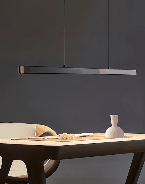 Modern black pendant light with adjustable hanging wire above dining table in minimalist room