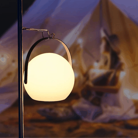 Portable lamp with warm LED light, sleek design, and adjustable brightness for indoor and outdoor use