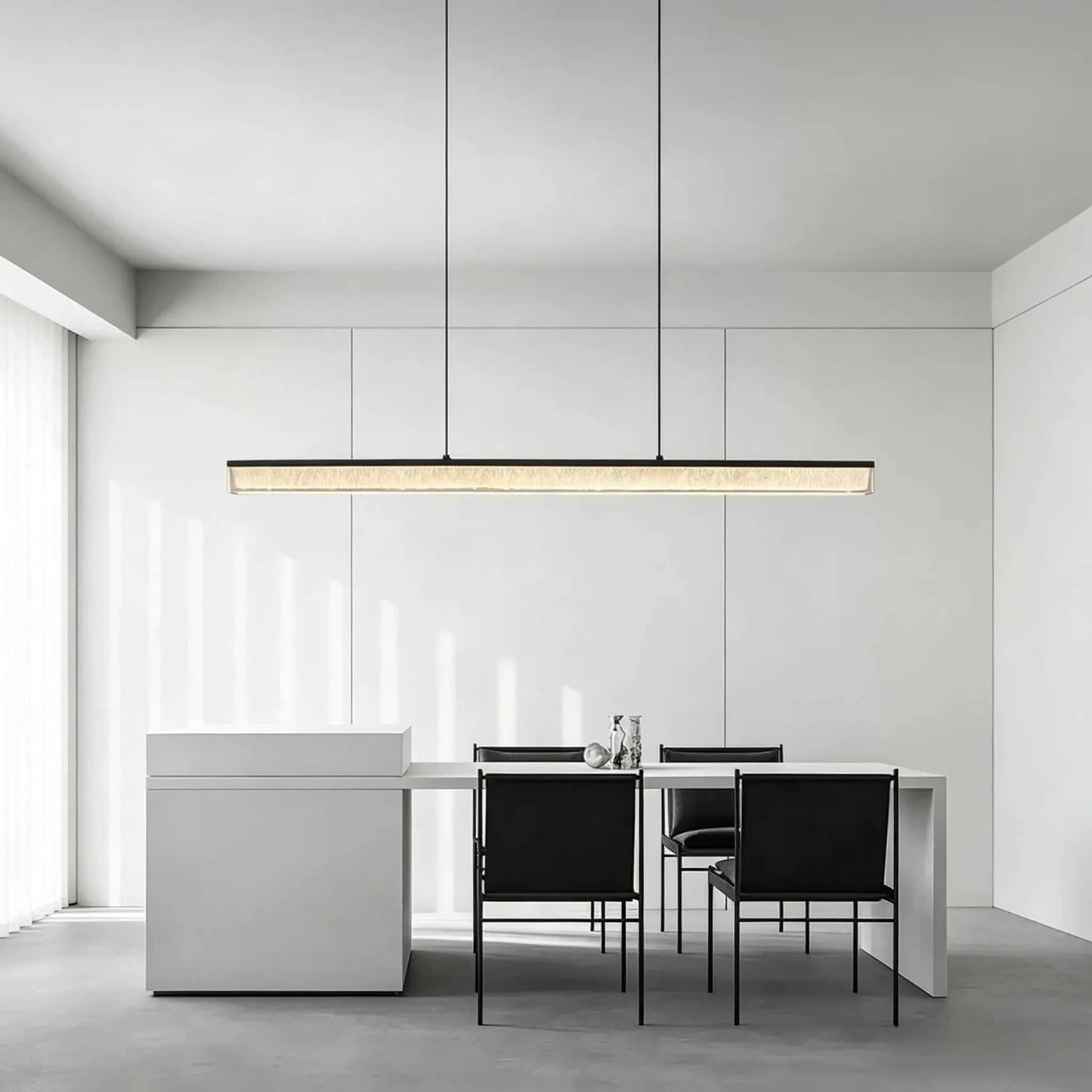 Italian Minimal Adjustable Linear Pendant Lamp with matte black iron frame and acrylic shade over dining table