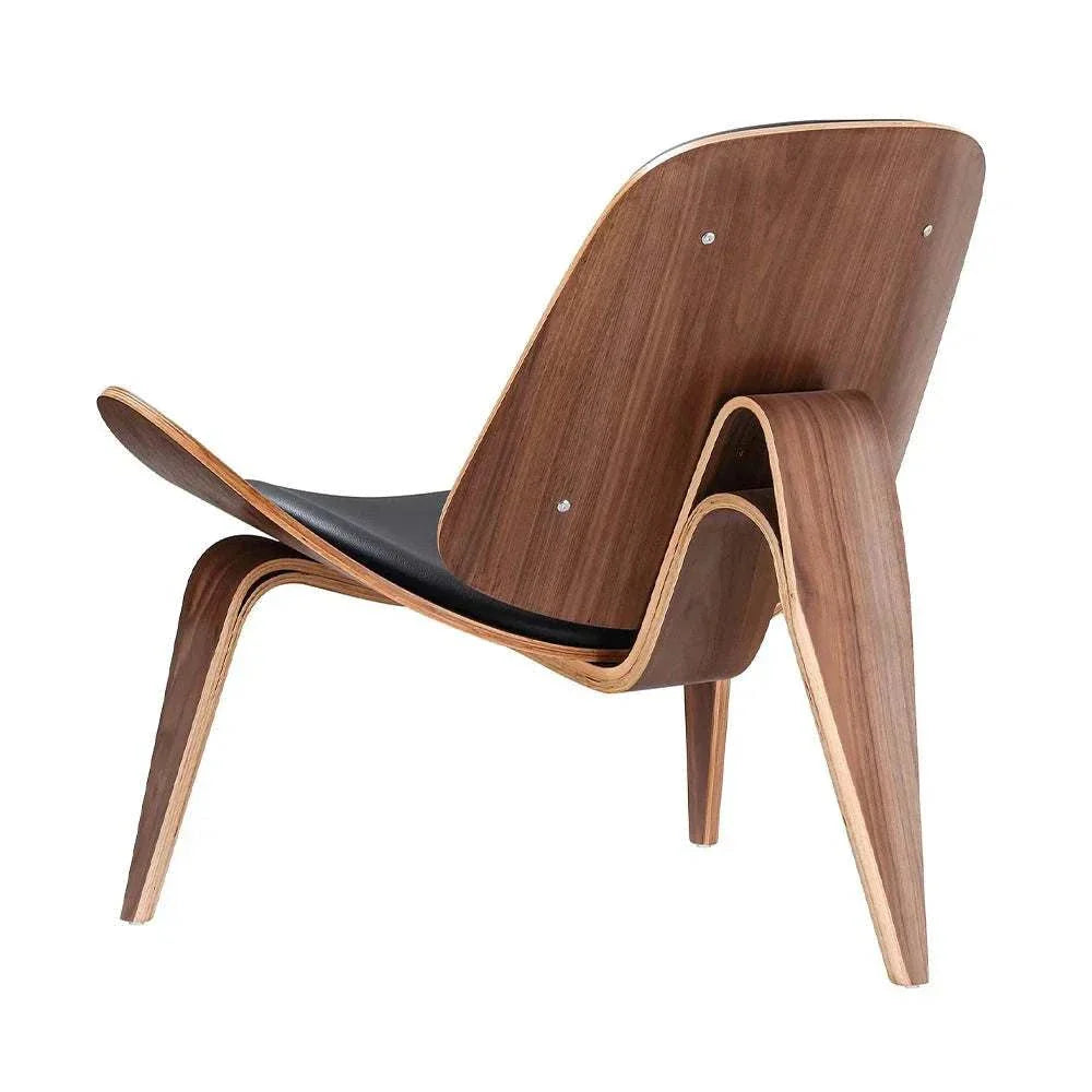 Shell Chair in walnut finish, genuine leather upholstery, and mid-century Danish design.