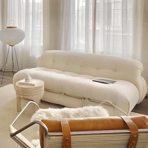 Beige retro midcentury modern sofa set with lamb fleece upholstery and stainless steel frame in bright living room