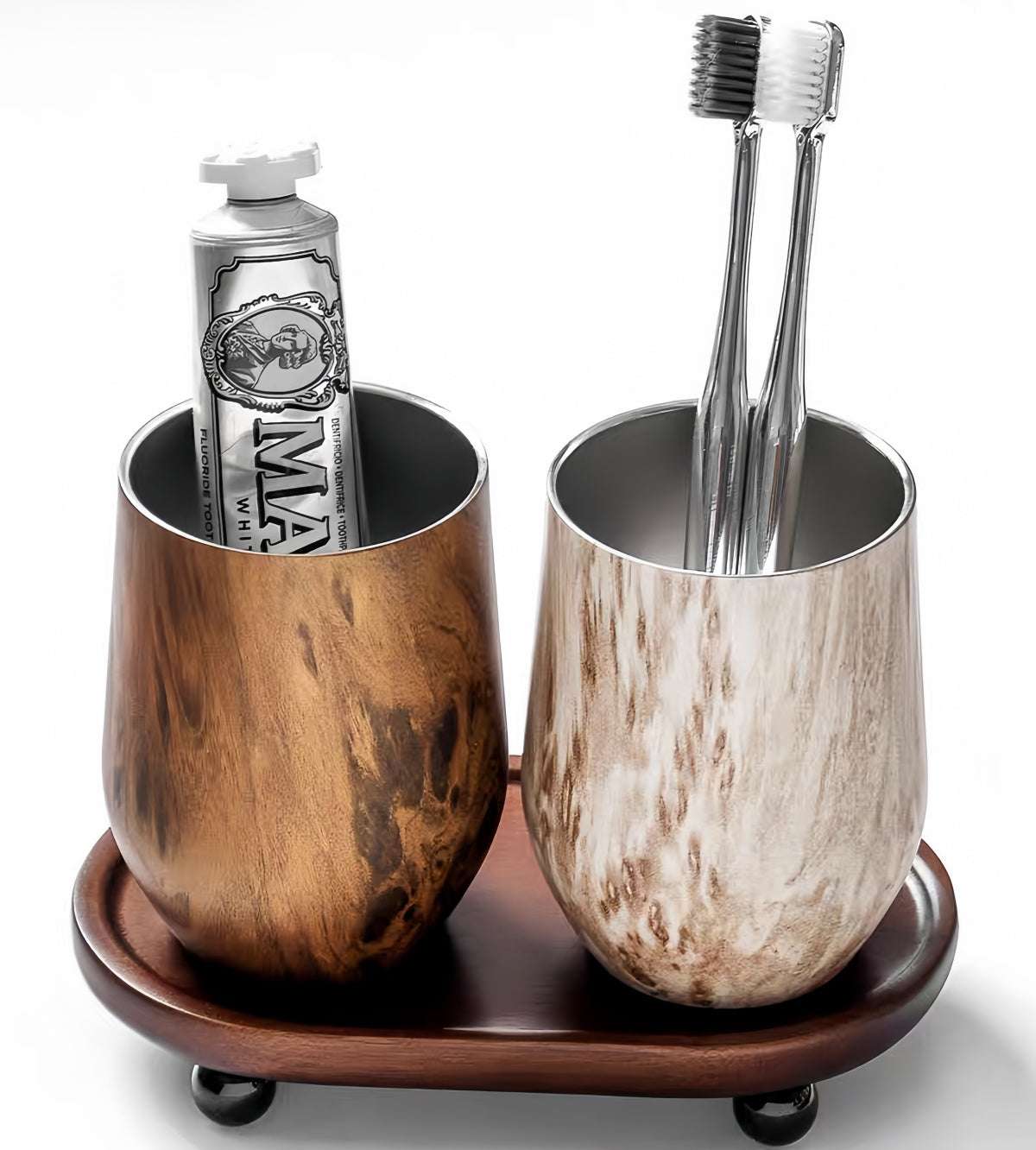 Solid wood toothbrush holder with Nordic vintage design organizing toothbrushes and toothpaste on bathroom countertop