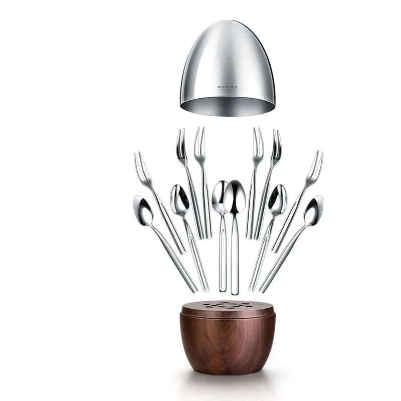 Light luxury tableware storage box with solid walnut base and polished stainless steel shell holding coffee spoons and dessert forks for elegant home decor and gift