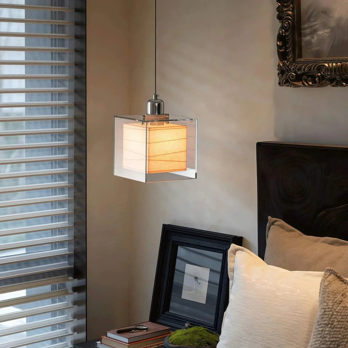 Mid-century square rice paper pendant light with chrome aluminum fixture hanging by adjustable cord