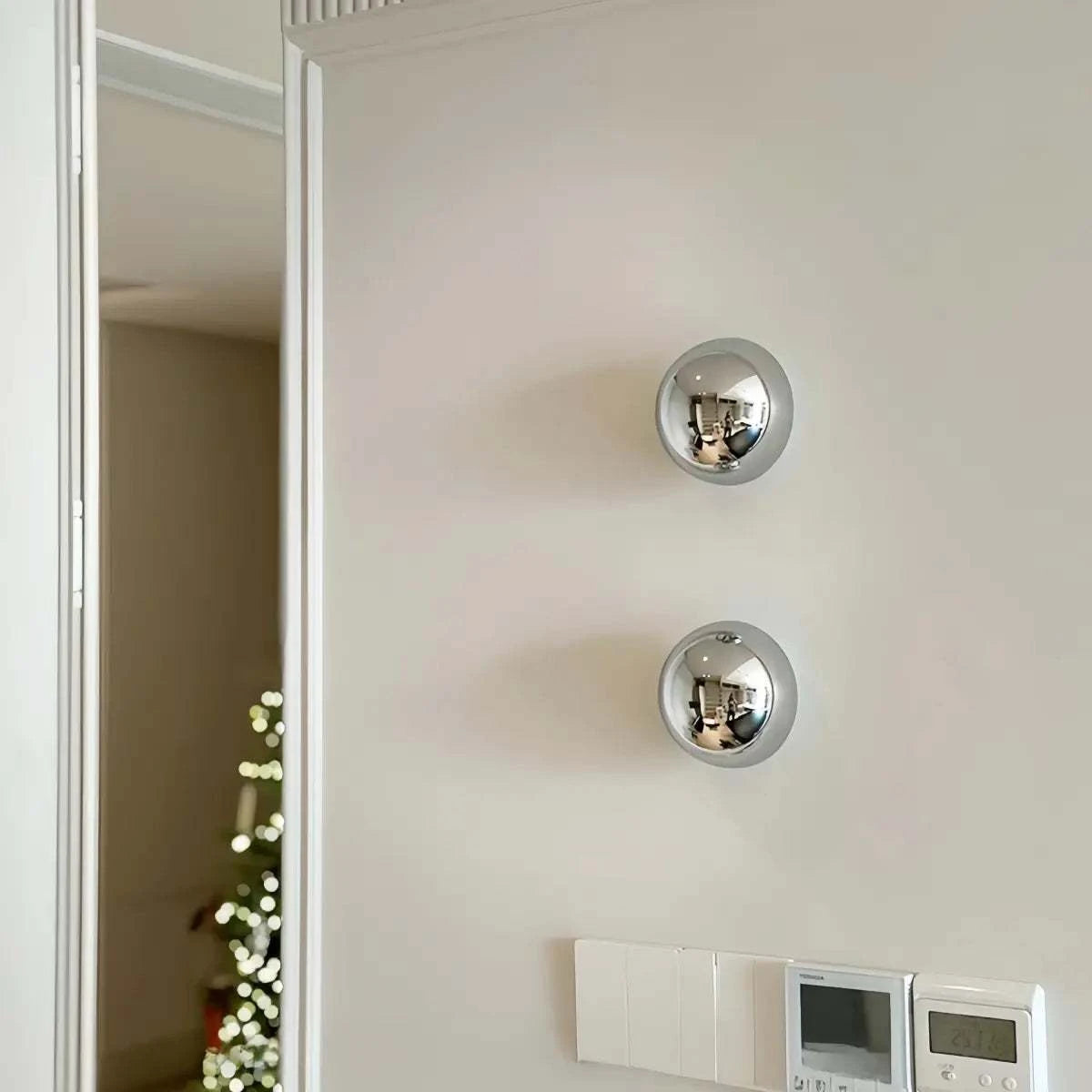 Vintage industrial metal globe wall sconce with LED ambient light on wall