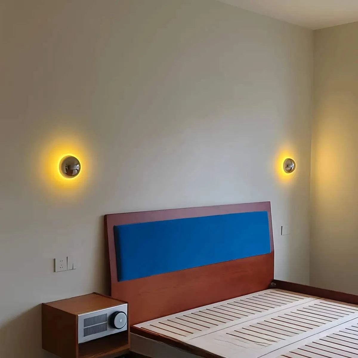 Vintage industrial metal globe wall sconce with acrylic shade emitting soft LED light for bedroom and hallway ambiance