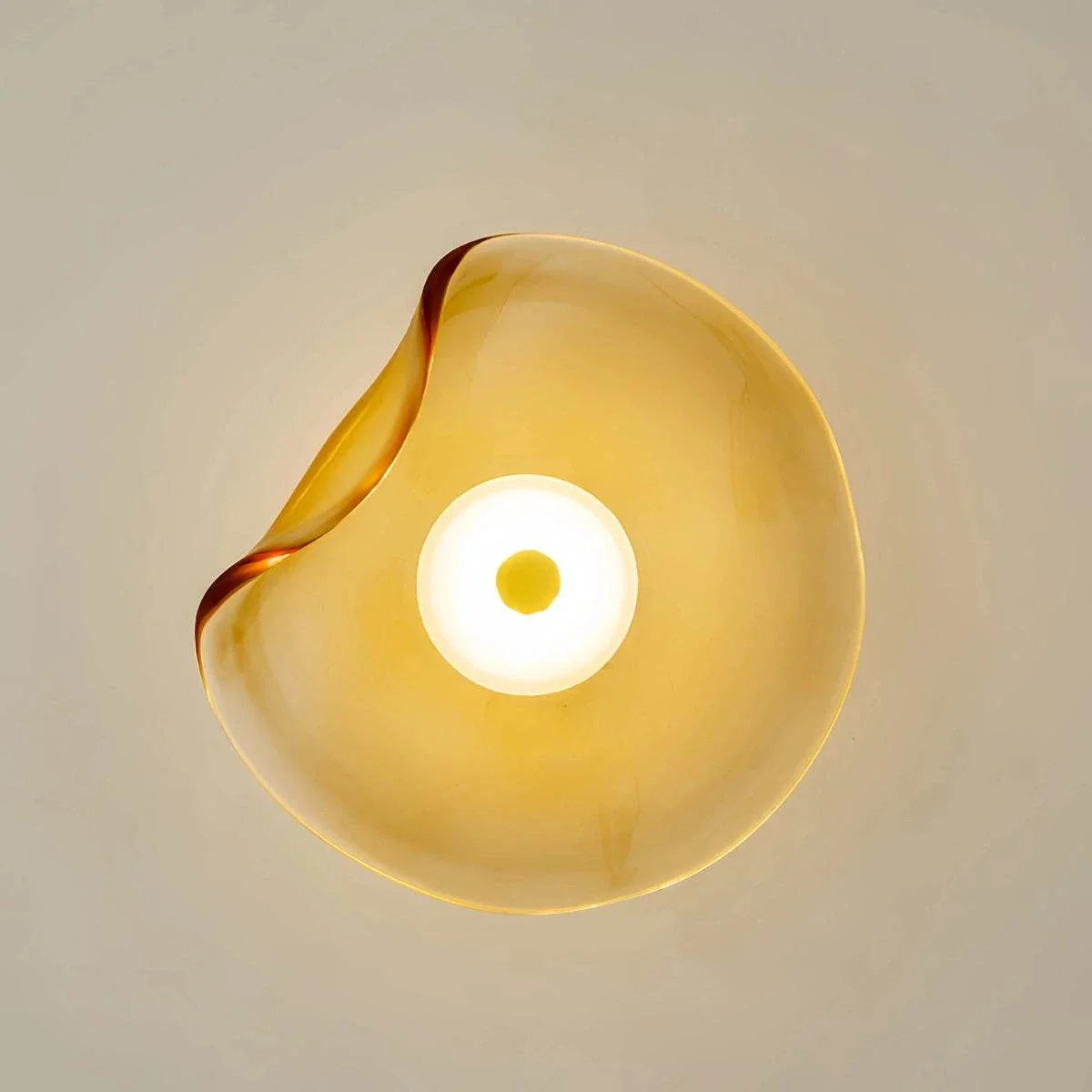 Round minimalist wall sconce with wrought iron frame and translucent glass shade, warm LED light, perfect for bedroom and living room decor