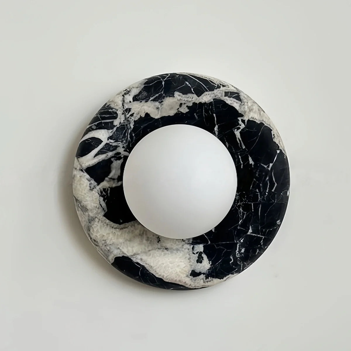 Natural travertine marble wall sconce with textured yellow marble and warm LED light for hotel and bedroom ambient lighting
