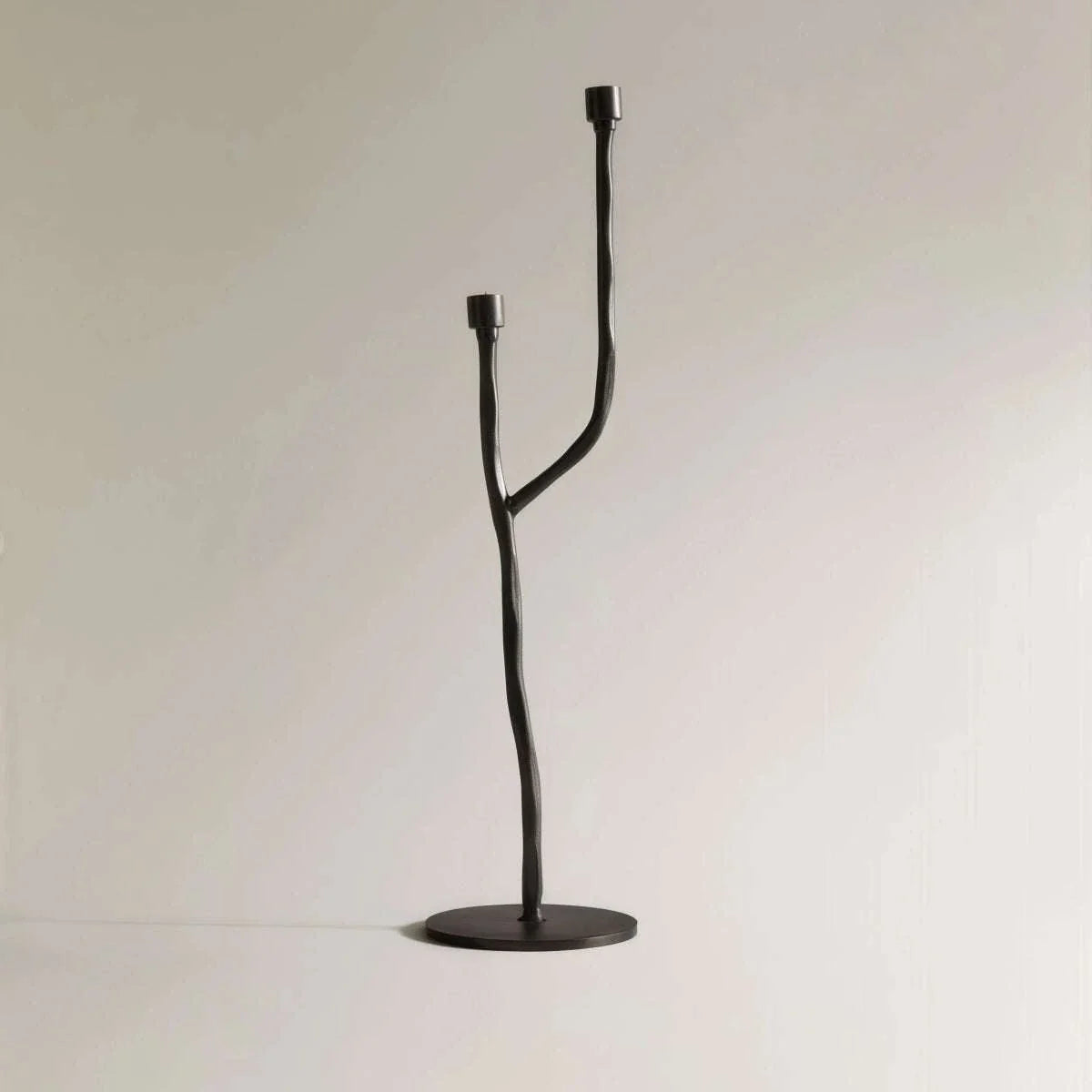 Matte black iron candelabra with European retro design for taper candles, ideal tabletop decor.