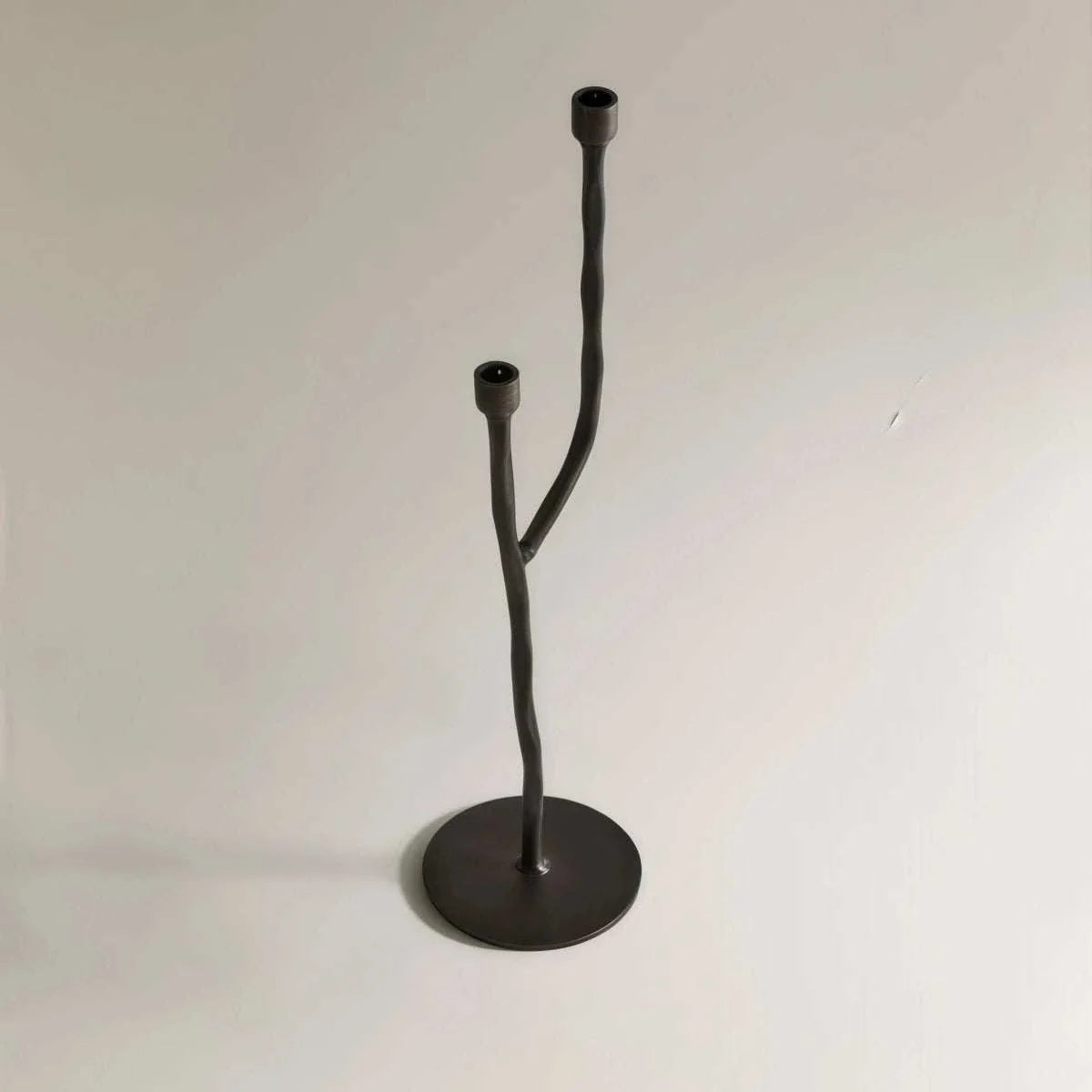 Matte black iron candelabra with European retro design holding taper branch candles on table display