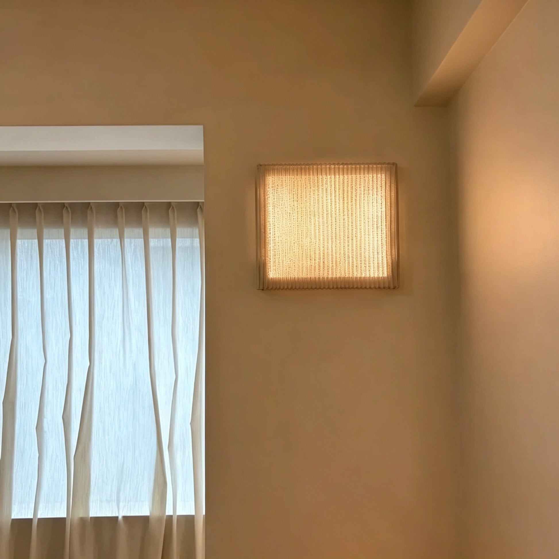 Nordic modern minimalist wall sconce with warm LED light and textured stainless steel mesh shade