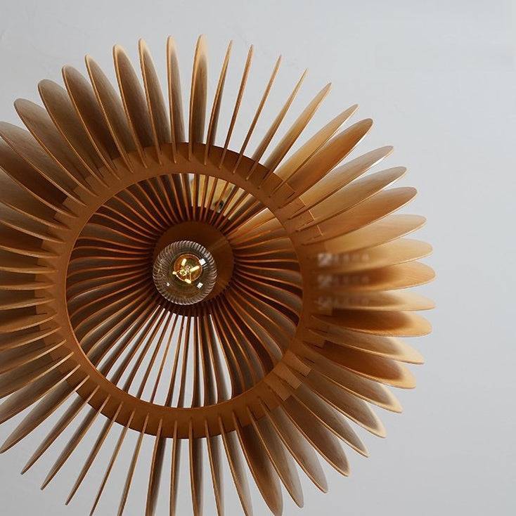 top view of modern handcrafted wood pendant light with multiple wooden blades and exposed bulb