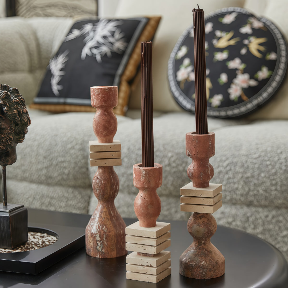 Marble candle holder in reddish-brown stone with natural veining, sculpted forms and stacked square accents; French-Style Vintage-Inspired Fireplace décor.