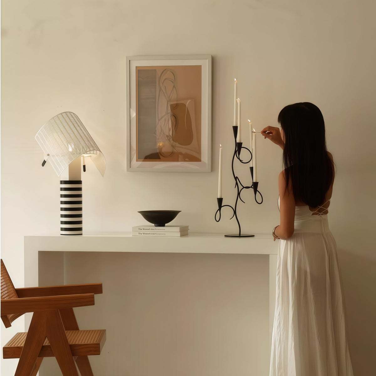 Black Wrought Iron candle holder with a slender branch-like frame and multiple curving arms for tapered candles
