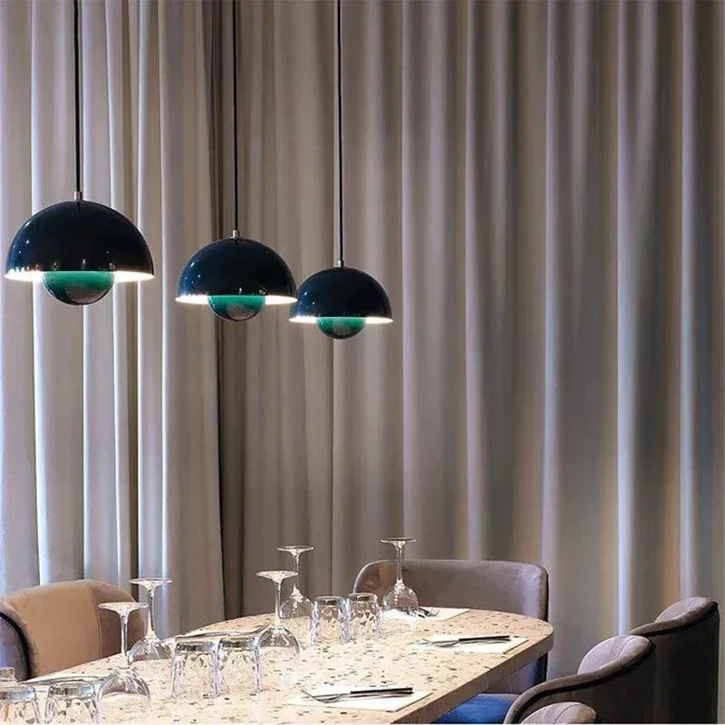 Modern Nordic kitchen island pendant lighting with black mushroom-shaped iron lampshades over a dining table