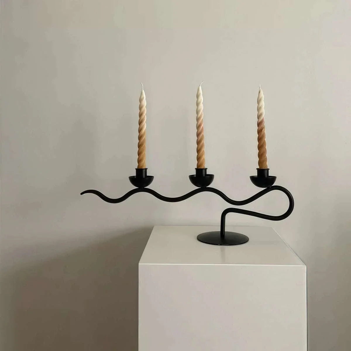 High-End Decorative Wrought Iron Candle Holder in black, with a flowing branch design and three spiral candles