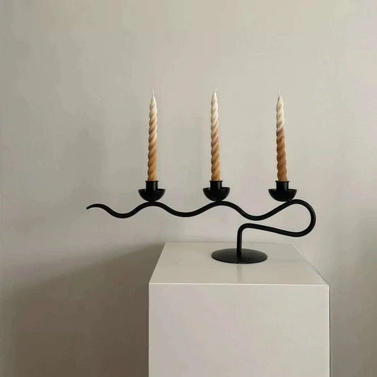 High-End Decorative Wrought Iron Candle Holder in black, with a flowing branch design and three spiral candles