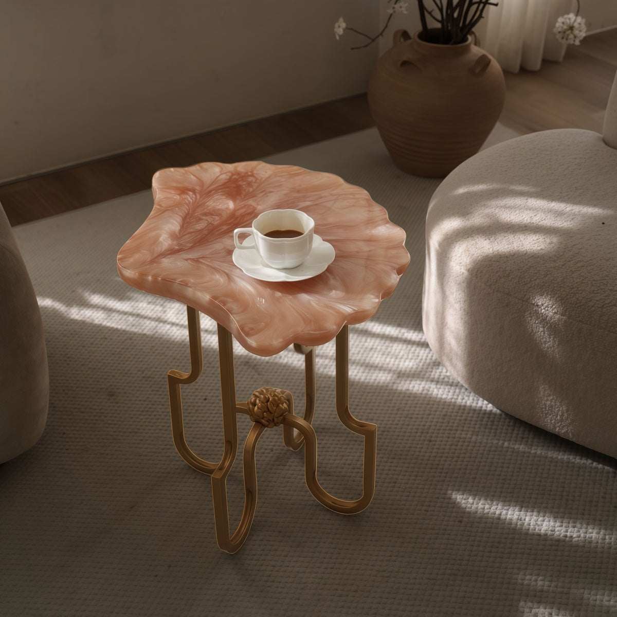 French Vintage-Style side table with coral pink resin shell top, marbled pattern, and sculptural gold metal legs
