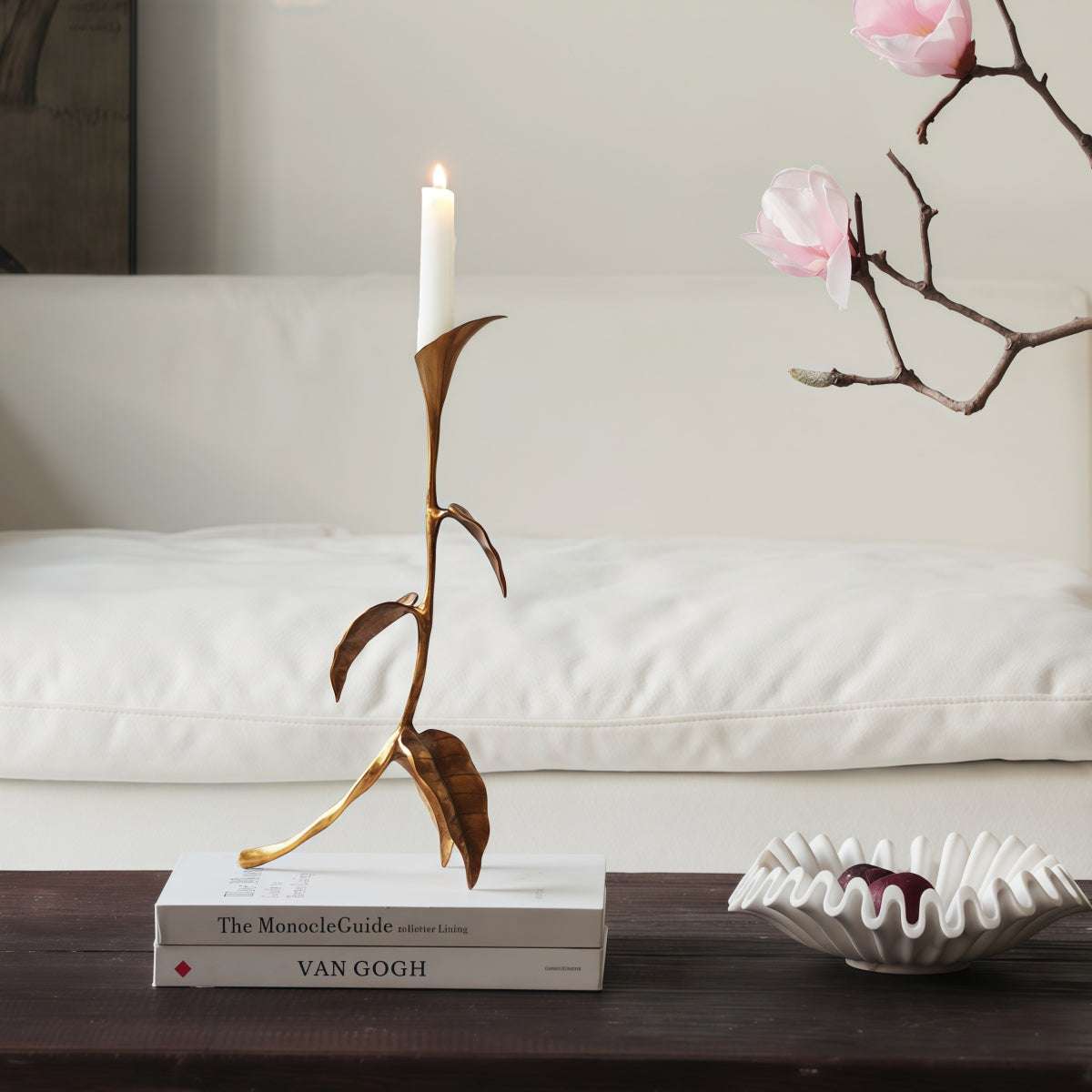 Cast Bronze Calla Lily candle holder in metallic bronze, featuring a slender sculptural stem and white taper candle.