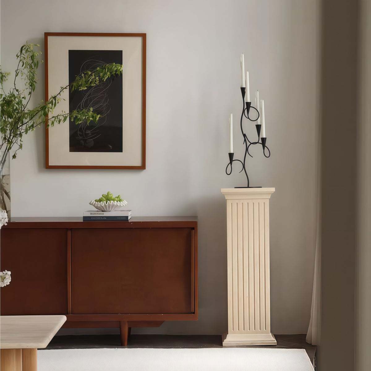 Candle holder in Black Wrought Iron with slender branch-like arms and multiple white taper candles.