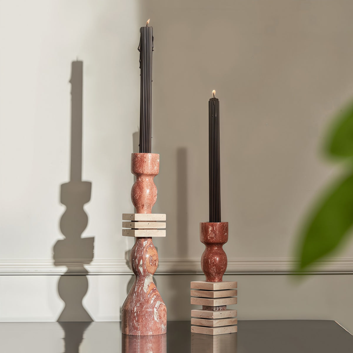 French-Style Vintage-Inspired Fireplace stone candle holders in red-brown with natural veining and stacked geometric bases.