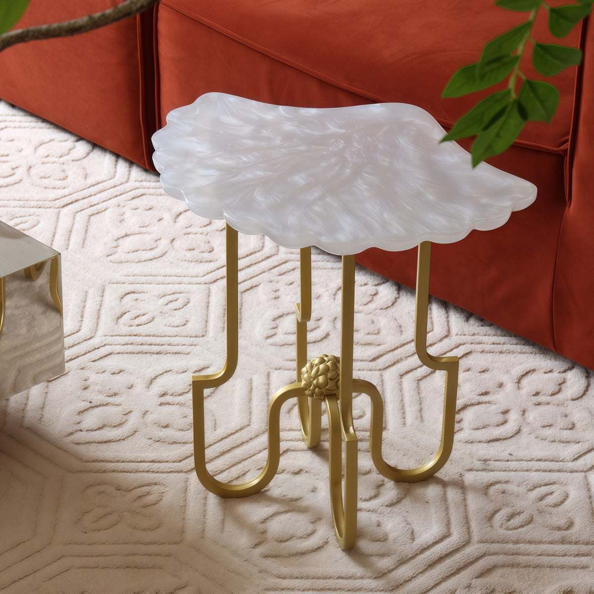 French Vintage-Style resin shell side table with pearlescent white tabletop and sculptural gold metal legs